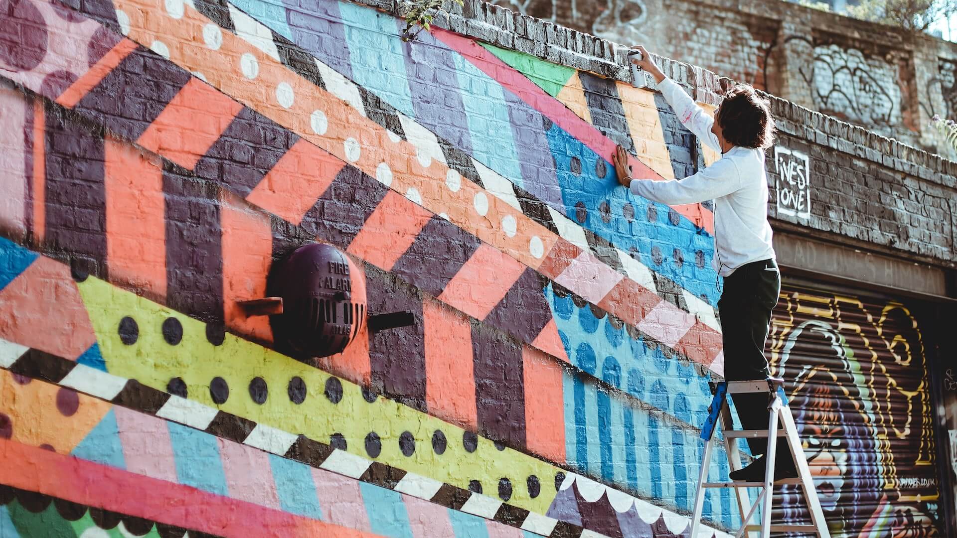Brick Lane street artist painting